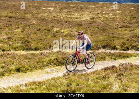 Parc national d'Exmoor - UN motard de montagne sur le point le plus élevé d'Exmoor, Dunkery Beacon 1705 pieds 520 mètres, Somerset Royaume-Uni Banque D'Images