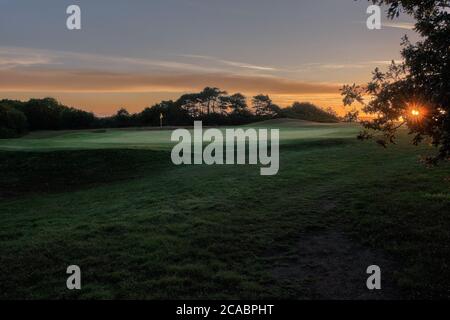 Sur le green de golf à l'aube Banque D'Images