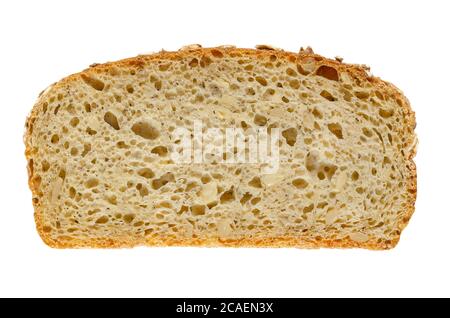 Tranche de pain d'épeautre, du dessus. Pain au levain, mélange de farine d'épeautre, de levain, de graines de tournesol et d'épices, cuit au four. Aliments de base. Banque D'Images