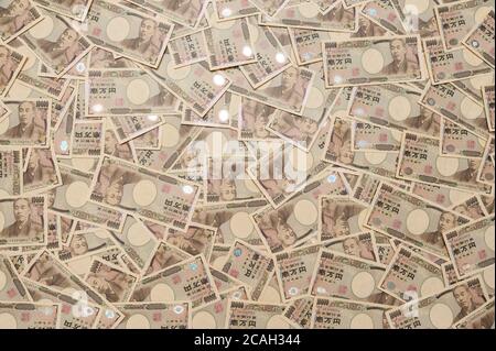 Yen - arrière-plan avec de l'argent japonais sur dix mille yen billet. Tir horizontal. Banque D'Images