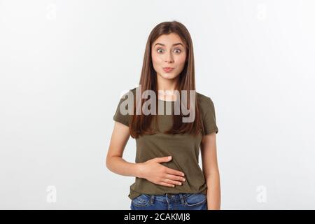 Femme enceinte avec ses mains sur son ventre, isolé contre fond blanc Banque D'Images
