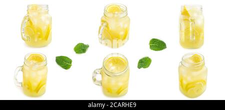 Pot Mason avec limonade à glace et feuilles de menthe de différents côtés sur fond blanc. Photo macro. Banque D'Images