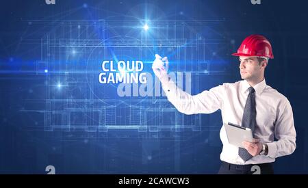 Beau architecte avec un casque dessin NUAGE inscription JEU, nouveau concept de technologie
