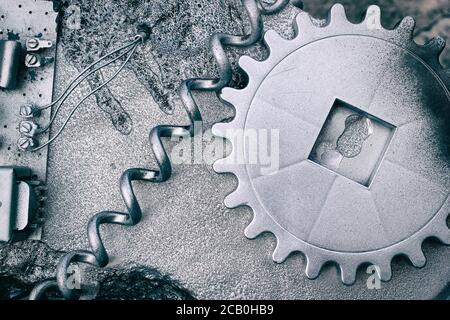 Les pignons et les roues gris argent créent un arrière-plan industriel en acier Banque D'Images