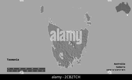 Forme de la Tasmanie, État de l'Australie, avec sa capitale isolée sur fond solide. Échelle de distance, aperçu de la région et libellés. Carte d'élévation à deux niveaux Banque D'Images