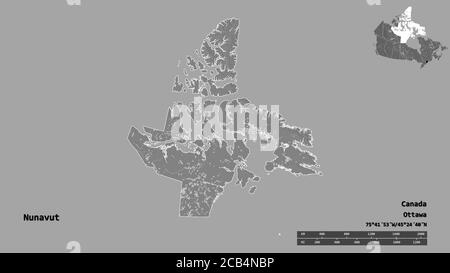 Forme du Nunavut, territoire du Canada, avec sa capitale isolée sur fond solide. Échelle de distance, aperçu de la région et libellés. Carte d'élévation à deux niveaux Banque D'Images