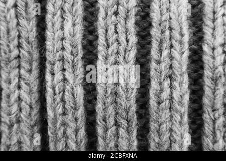 texture d'arrière-plan en laine tricotée macro avec bord-côte gris sélectif Banque D'Images