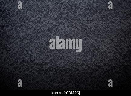 Gros plan sur une surface détaillée en similicuir gris foncé ou noir. Arrière-plan texturé plein format haute résolution. Banque D'Images