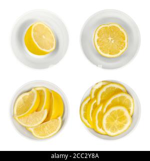 Citrons dans des bols en verre blanc. Demi-morceaux, quartiers et tranches de citron fraîchement coupés. Agrumes mûrs et jaunes, utilisés à des fins culinaires. Citron limon. Banque D'Images