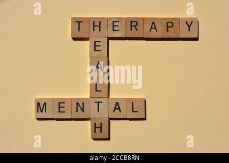 Mental, Santé, thérapie, mots en lettres de l'alphabet en bois en mots croisés pour isolé sur fond simple Banque D'Images
