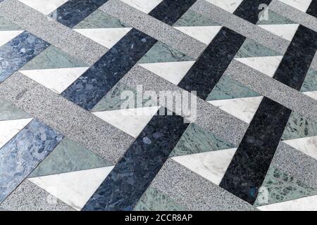 Carrelage en mosaïque de pierre de style ancien avec motif géométrique, texture photo d'arrière-plan Banque D'Images