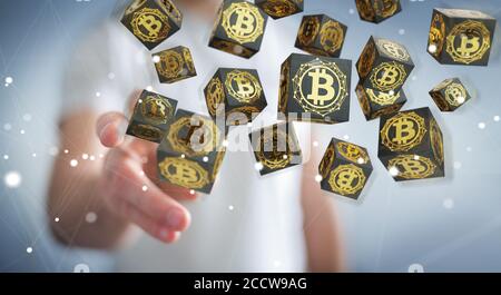 Homme d'affaires sur un arrière-plan flou en utilisant le rendu 3D de crypto-monnaie bitcoins Banque D'Images