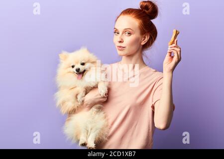 Woman Biting un os Photo Stock - Alamy