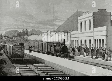 Espagne, Andalousie. Ligne Espeluy-Jaén. Ligne de chemin de fer inaugurée en 1881. Elle faisait partie à l'origine de la ligne Linares-Puente Genil, construite par la Compañia de los Ferrocarriles Andaluces entre 1879 et 1893. La section entre Espeluy et Jaén a été achevée en 1881, bien avant le reste de la ligne, permettant à la ville de Jaén d'être reliée au reste du réseau ferroviaire espagnol. Arrivée à la gare de Jaén du premier train de voyageurs de la nouvelle ligne de chemin de fer, le 18 août 1881. Illustration par M. Ruiz. Gravure par Bernardo Rico. La Ilustracion Española y Americana, 1881. Banque D'Images