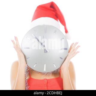 photo de femme dans chapeau de père noël avec grande horloge Banque D'Images