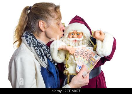 Femme embrassant le modèle du Père Noël Banque D'Images