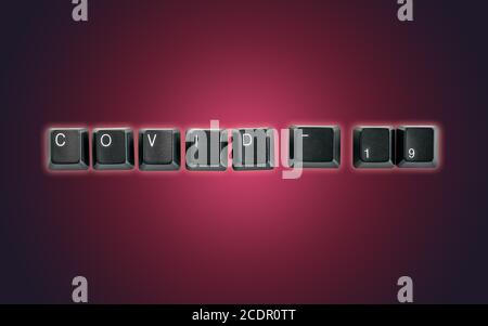 Clavier d'ordinateur orthographe Covid-19, isolé sur fond sombre Banque D'Images