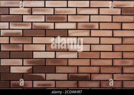 Mur de briques marron. Arrière-plan abstrait texturé. Espace pour le texte Banque D'Images