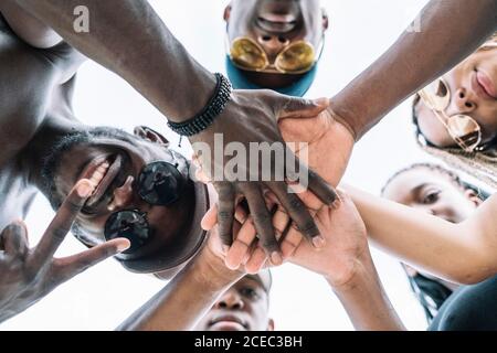 Group of friends stacking hands Stock Photo