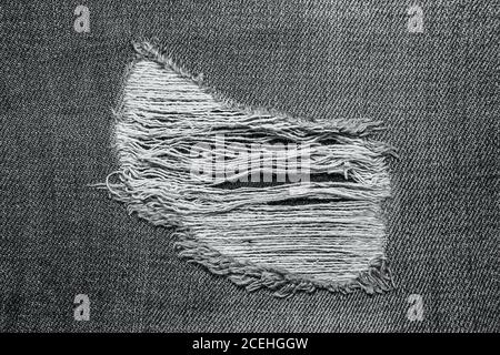 jean gris denim avec motif vieux jeans déchirés de mode Banque D'Images