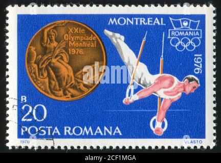 ROUMANIE - VERS 1976 : timbre imprimé par la Roumanie, gymnastique d'exposition, vers 1976. Banque D'Images