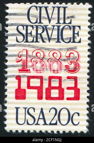 ÉTATS-UNIS - VERS 1983 : timbre imprimé par les États-Unis d'Amérique, affiche l'emblème de la fonction publique, vers 1983 Banque D'Images