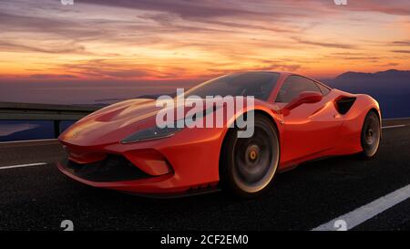 Ferrari F8 Tribto tout en roulant rapidement sur une route qui traverse un paysage magnifique après le coucher du soleil Banque D'Images