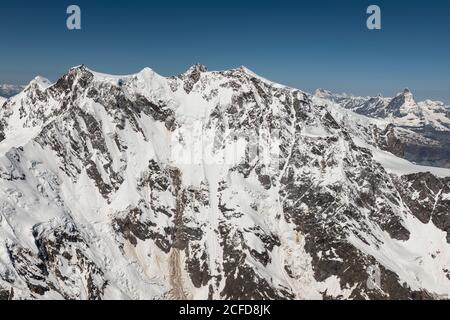 Italie, Piémont, Suisse, Canton du Valais, face est du massif de Monte Rosa, en arrière-plan Grand Combin, Dent d'Herens et Matterhorn Banque D'Images