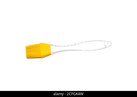 Brosse en silicone jaune avec poignée transparente Banque D'Images