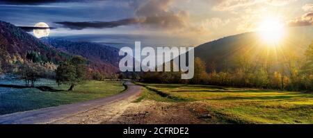 concept de changement de jour et de nuit au-dessus de la route de campagne dans la vallée. paysage d'automne merveilleux dans les montagnes avec le soleil et la lune. forêt sur les collines en couleur Banque D'Images