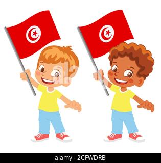 Drapeau tunisien en main. Drapeau de retenue des enfants. Drapeau national de la Tunisie Banque D'Images