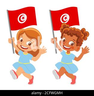 Drapeau tunisien en main. Drapeau de retenue des enfants. Drapeau national de la Tunisie Banque D'Images