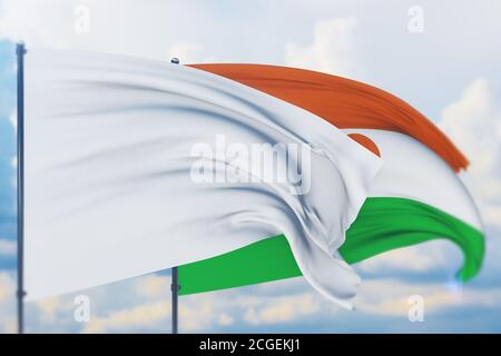 Drapeau blanc sur le mât agitant dans le vent et drapeau du Niger. Vue en gros plan, illustration 3D. Banque D'Images