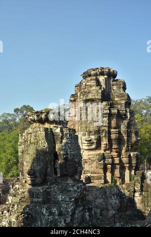 Faces de pierre dans le temple du Bayon, Angkor Thom, Cambodge Banque D'Images