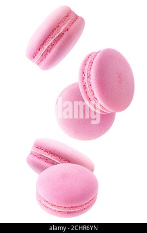 Cinq macarons roses tombant isolés sur fond blanc Banque D'Images