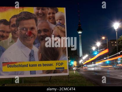 An election poster of the liberal FDP party shows its party leader Guido Westerwelle near the Fernsehturm television tower in Berlin  August 31, 2009.   REUTERS/Thomas Peter  (GERMANY POLITICS ELECTIONS)