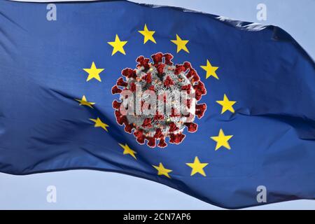 Photo montage, drapeau européen dans le vent avec coronvirus, pandémie dans l'Union européenne Banque D'Images