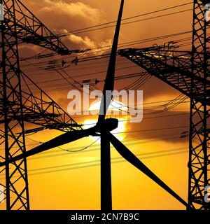 Deux pylônes de ligne aérienne et une éolienne devant le soleil, Witten, Allemagne, Europe Banque D'Images