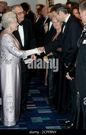 Britain's Queen Elizabeth meets actor Mads Mikkelsen during the world premiere of the latest James Bond movie 'Casino Royale' at the Odeon cinema in Leicester Square in London November 14, 2006.    REUTERS/Stephen Hird     (BRITAIN)