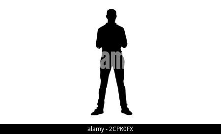 Silhouette Homme décontracté utilisant le téléphone portable Smart écrire un message. Banque D'Images