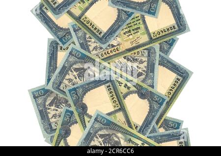 50 rupees népalaises bills volant isolé sur blanc. De nombreux billets tombant avec un espace de copie blanc à gauche et à droite Banque D'Images