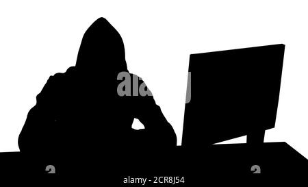 Hacker à capuche Silhouette utilisant un ordinateur portable et un smartphone. Banque D'Images