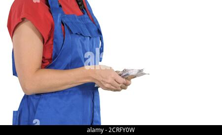 Une femme dans un nombre de vêtements des travailleurs de l'argent sur fond blanc. Banque D'Images