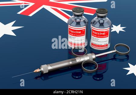 La vaccination en Australie concept. Flacons de vaccin avec seringue sur le drapeau australien, rendu 3D isolé sur fond blanc Banque D'Images