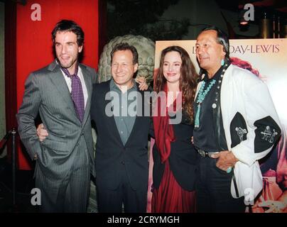 The stars and director from the new film 'The Last of the Mohicans' pose together at the film's premiere at Mann's Chinese Theatre in Los Angeles September 24, 1992.  Shown (L-R) Daniel Day-Lewis; director Michael Mann; Madeleine Stowe and Russell Means.  The film deals with the war between England and France and their Native American allies.  REUTERS/Fred Prouser (UNITED STATES)