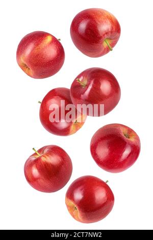 Tranches de pomme rouge tombant isolées sur fond blanc, Banque D'Images