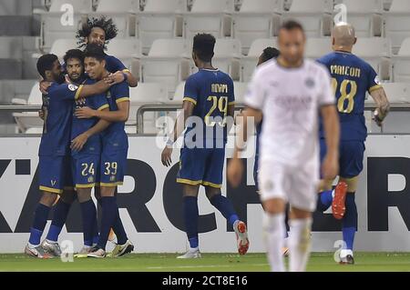 Doha, Qatar. 21 septembre 2020. Khalid Al-Ghannam (2e L) d'Al Nassr célèbre après avoir marquant le but d'ouverture lors du match de football du groupe D de l'AFC Asian Champions League entre Al Sadd SC du Qatar et Al Nassr d'Arabie Saoudite à Doha, capitale du Qatar, le 21 septembre 2020. Credit: Nikku/Xinhua/Alay Live News Banque D'Images