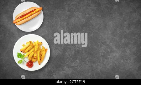 Vue de dessus des fast-foods. Hot dog et frites isolées sur un fond sombre avec espace de copie. Aliments malsains. Composition des aliments. Banque D'Images