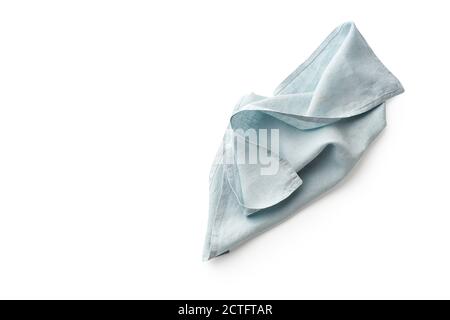 Linge de lit bleu, serviette de cuisine rustique isolée sur fond blanc. Image au-dessus du tissu plié pour la maquette, l'espace de copie Banque D'Images