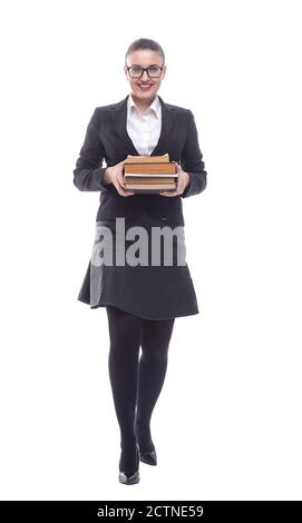en pleine croissance. une femme d'affaires souriante avec une pile de livres Banque D'Images